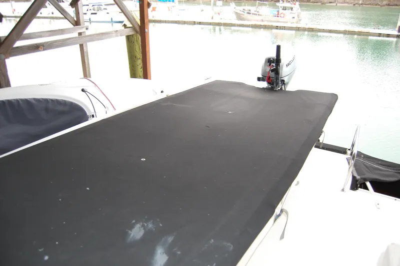 Sumptin Special Yacht Photos Pics 1990 Ocean Alexander 520 Pilothouse with covered deck and outboard motor at marina.