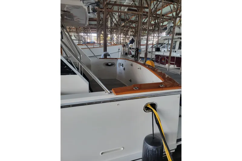 Sumptin Special Yacht Photos Pics 1990 Ocean Alexander 520 Pilothouse yacht docked in a marina, showcasing sleek design.