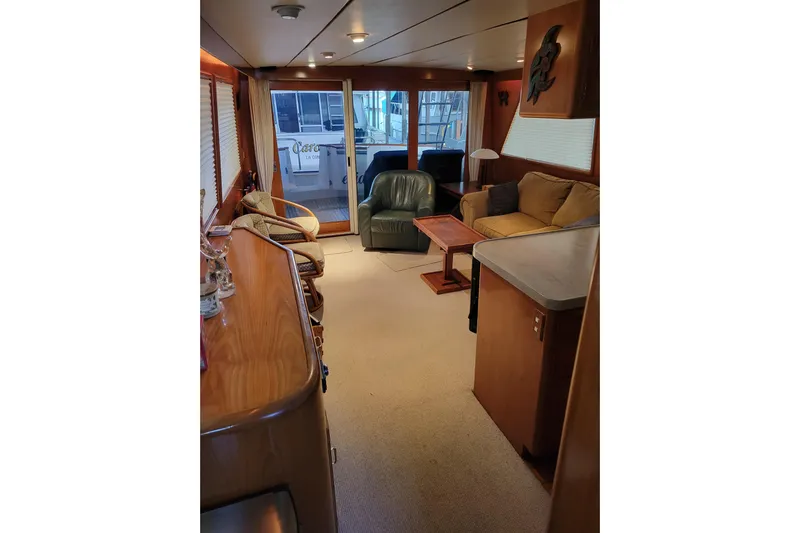 Sumptin Special Yacht Photos Pics Luxurious interior of 1990 Ocean Alexander 520 Pilothouse yacht with cozy seating and elegant decor.