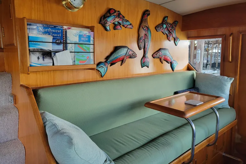 Sumptin Special Yacht Photos Pics Interior of 1990 Ocean Alexander 520 Pilothouse with fish decor and green seating.