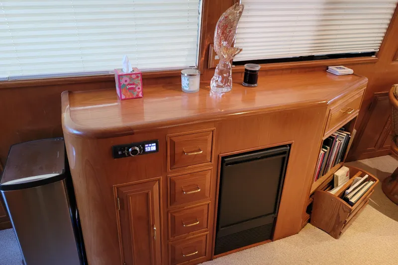 Sumptin Special Yacht Photos Pics Luxurious interior of 1990 Ocean Alexander 520 Pilothouse with wooden cabinetry and decor.