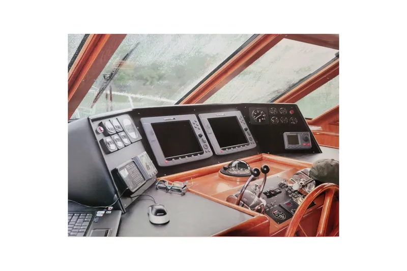 Sumptin Special Yacht Photos Pics Pilothouse interior of 1990 Ocean Alexander 520, featuring navigation equipment and controls.