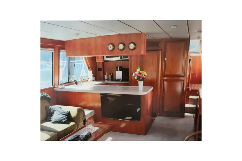 Sumptin Special Yacht Photos Pics Luxurious interior of 1990 Ocean Alexander 520 Pilothouse yacht with elegant wood finishes.