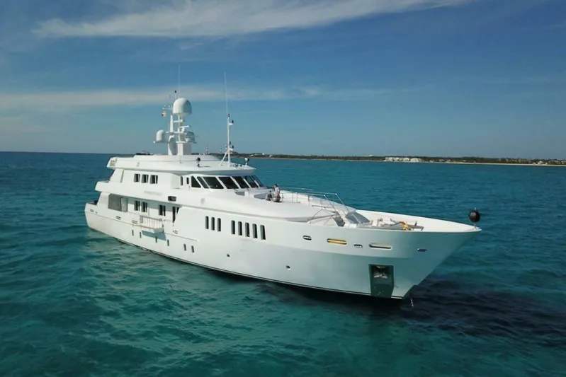 Unforgettable Yacht Photos Pics Luxurious 2003 Royal Denship M.Y. yacht cruising in clear blue waters.