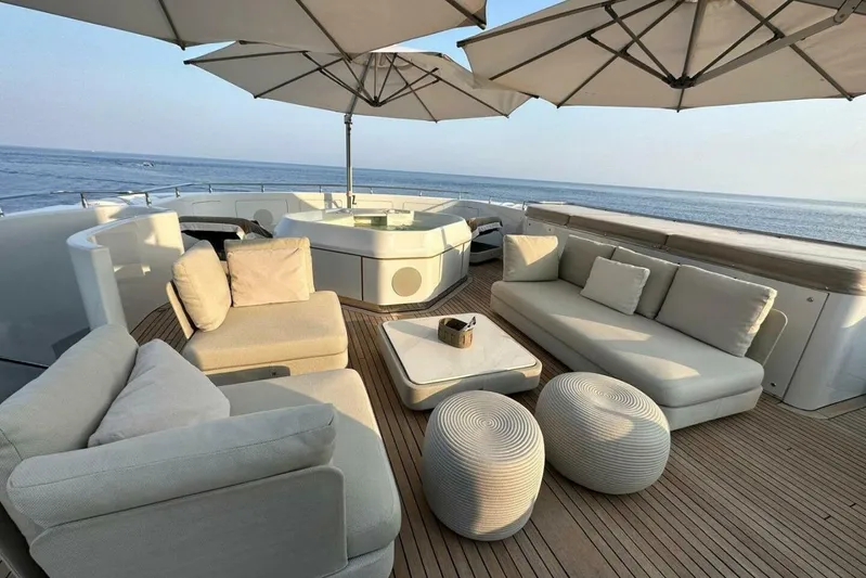 Unforgettable Yacht Photos Pics Luxurious Royal Denship M.Y. 2003 yacht deck with elegant seating and ocean view.