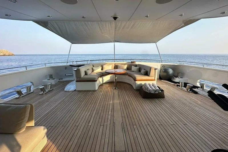 Unforgettable Yacht Photos Pics Luxurious 2003 Royal Denship M.Y. yacht deck with elegant seating and ocean view.