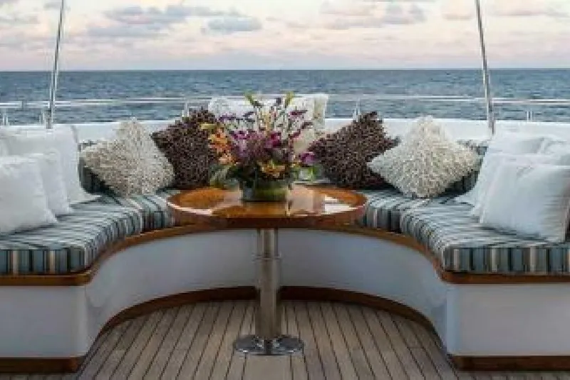 Unforgettable Yacht Photos Pics Luxurious 2003 Royal Denship M.Y. yacht deck with elegant seating and ocean view.