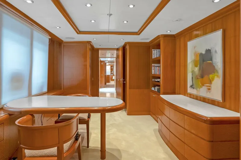 Unforgettable Yacht Photos Pics Luxurious interior of 2003 Royal Denship M.Y. yacht with elegant wood paneling and modern decor.