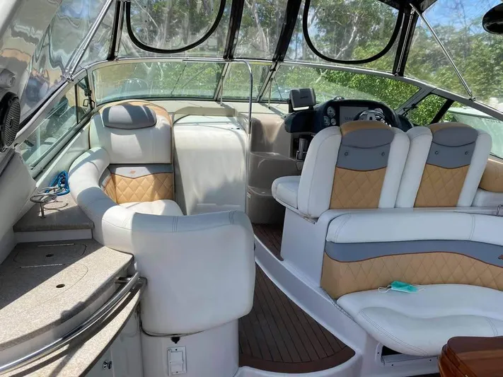  Yacht Photos Pics 2022 Four Winns 238 Vista boat interior with plush seating and modern dashboard.