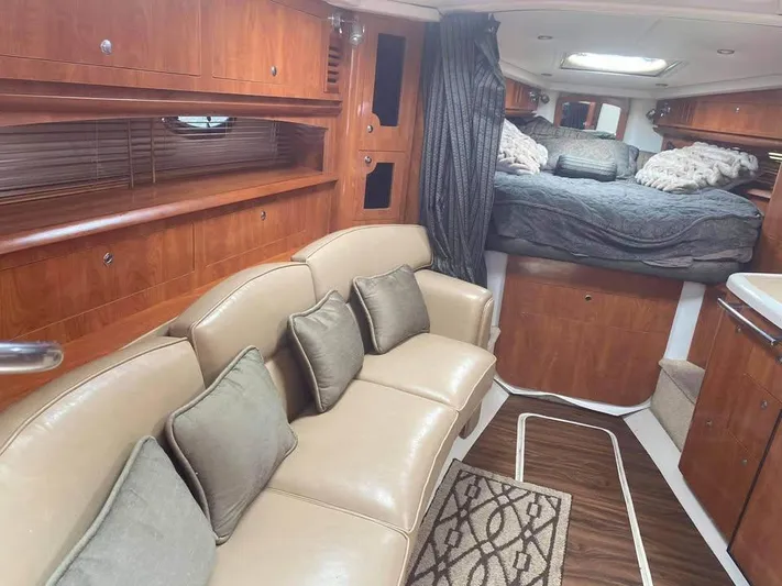  Yacht Photos Pics Interior of 2022 Four Winns 238 Vista boat with cozy seating and sleeping area.