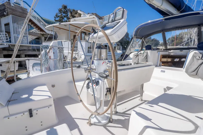Aries Yacht Photos Pics 2002 Catalina 380 sailboat cockpit with steering wheel and navigation instruments.