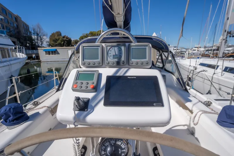 Aries Yacht Photos Pics Cockpit of 2002 Catalina 380 sailboat with navigation instruments and steering wheel.