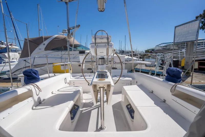 Aries Yacht Photos Pics Cockpit of 2002 Catalina 380 sailboat docked at marina under clear blue sky.