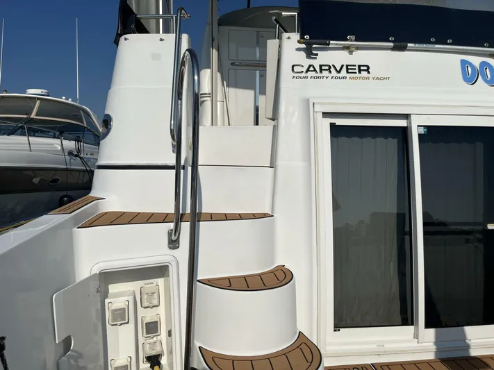  Yacht Photos Pics 2003 Carver 444 Cockpit Motor Yacht with sleek design and wooden accents.