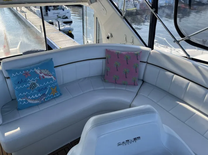  Yacht Photos Pics 2003 Carver 444 Cockpit Motor Yacht interior with white seating and decorative pillows.