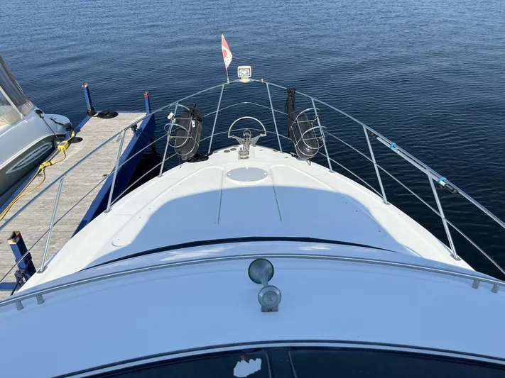  Yacht Photos Pics 2003 Carver 444 Cockpit Motor Yacht docked on calm water.