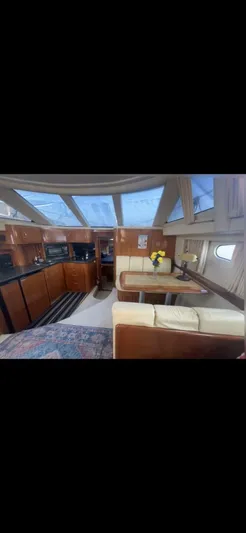  Yacht Photos Pics Interior of 2003 Carver 444 Cockpit Motor Yacht with kitchen and dining area.