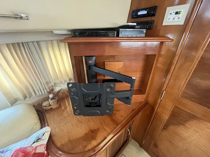  Yacht Photos Pics 2003 Carver 444 Cockpit Motor Yacht interior with TV mount and control panel.