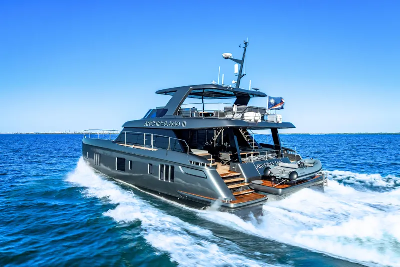 Skip The Wait - Trade Ins Considered Yacht Photos Pics Luxurious 2026 Sunreef 60 Power yacht cruising on open blue sea.