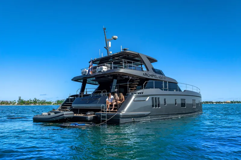 Skip The Wait - Trade Ins Considered Yacht Photos Pics Luxurious 2026 Sunreef 60 Power yacht on serene blue waters.