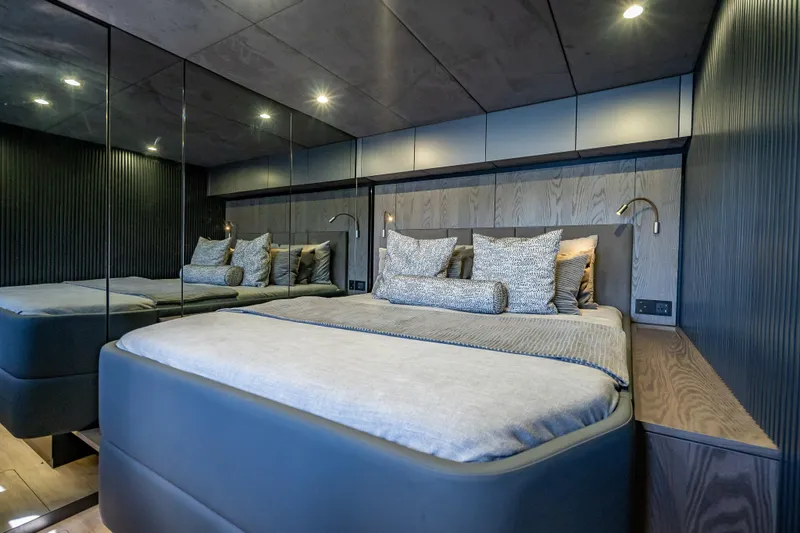 Skip The Wait - Trade Ins Considered Yacht Photos Pics Luxurious bedroom interior on 2026 Sunreef 60 Power yacht, featuring modern design and elegant bedding.