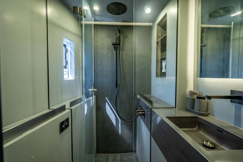 Skip The Wait - Trade Ins Considered Yacht Photos Pics Modern bathroom interior on 2026 Sunreef 60 Power yacht, featuring sleek design and fixtures.