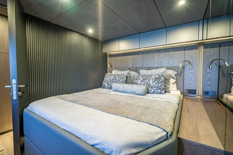 Skip The Wait - Trade Ins Considered Yacht Photos Pics Luxurious bedroom interior on 2026 Sunreef 60 Power yacht, featuring modern design and elegant bedding.