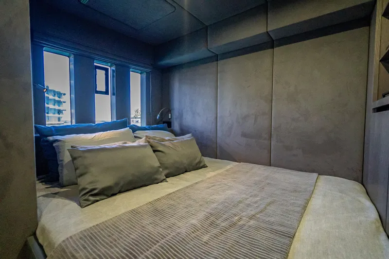 Skip The Wait - Trade Ins Considered Yacht Photos Pics Luxurious bedroom interior of 2026 Sunreef 60 Power yacht with modern design and plush bedding.