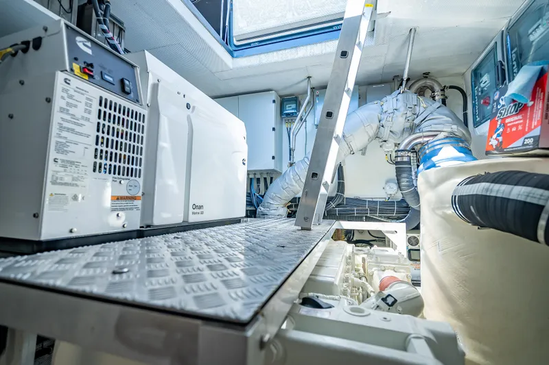 Skip The Wait - Trade Ins Considered Yacht Photos Pics Engine room of 2026 Sunreef 60 Power yacht with Onan generator and equipment.