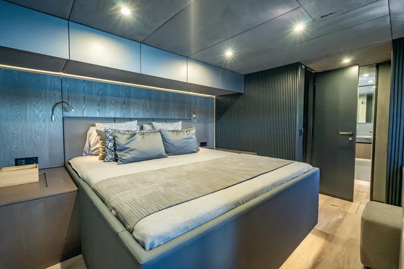 Skip The Wait - Trade Ins Considered Yacht Photos Pics Luxurious bedroom interior of 2026 Sunreef 60 Power yacht with modern design.