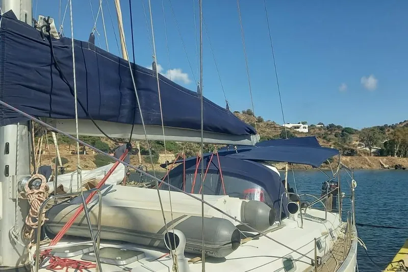  Yacht Photos Pics Sailboat Beneteau 50, 1996 model, docked with blue covers and scenic background.