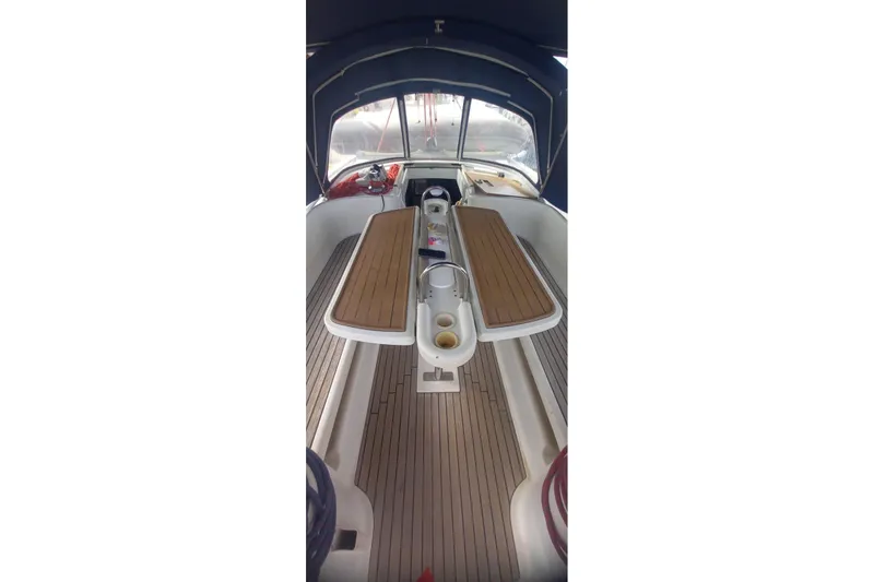  Yacht Photos Pics 1996 Beneteau 50 yacht cockpit with wooden seating and canopy.