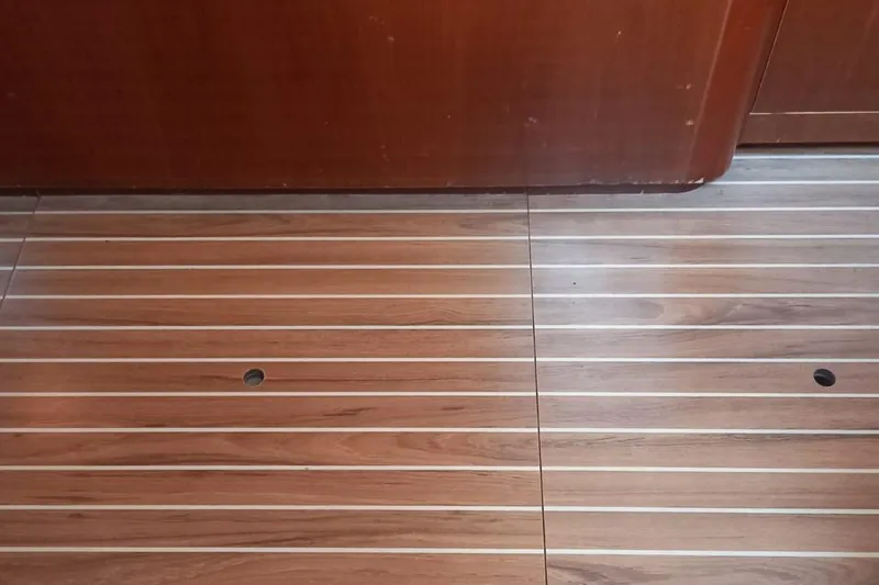  Yacht Photos Pics Teak flooring on a 1996 Beneteau 50 yacht interior, showcasing elegant wood finish.