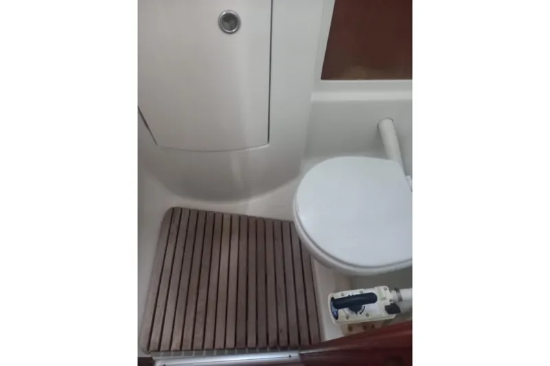  Yacht Photos Pics Beneteau 50 yacht bathroom with wooden floor and white toilet, 1996 model.
