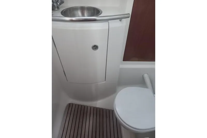  Yacht Photos Pics Bathroom interior of 1996 Beneteau 50 yacht with sink and toilet.