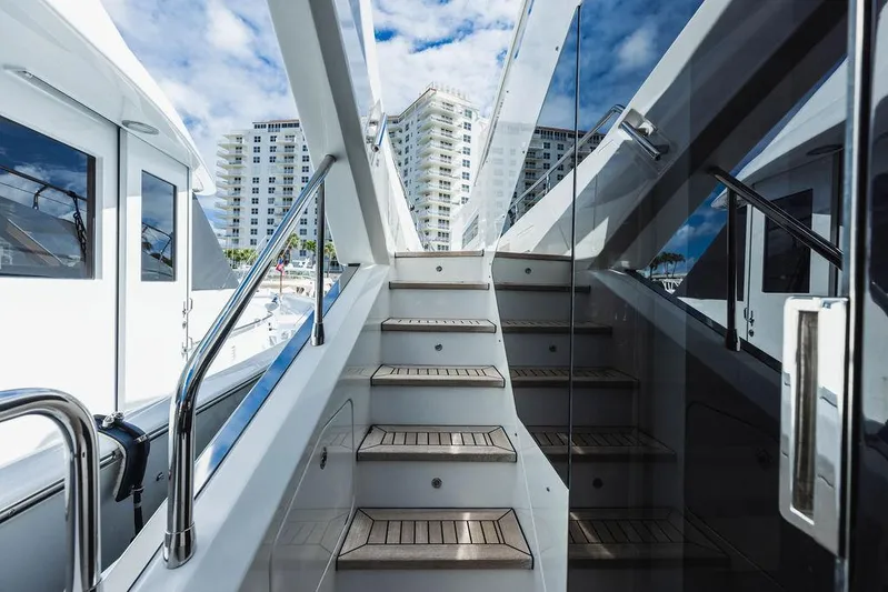 Majestic Moments Yacht Photos Pics Staircase on 2019 Azimut Grande 27 METRI yacht with cityscape background.