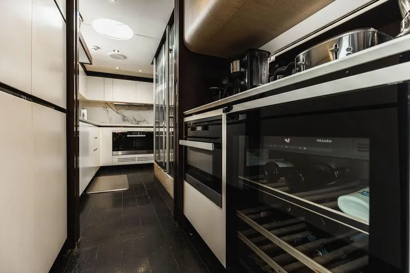 Majestic Moments Yacht Photos Pics Luxurious kitchen interior of 2019 Azimut Grande 27 METRI yacht with modern appliances.