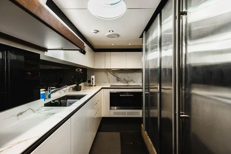 Majestic Moments Yacht Photos Pics Luxurious kitchen interior of 2019 Azimut Grande 27 METRI yacht with modern appliances.