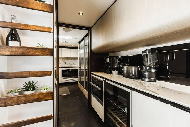 Majestic Moments Yacht Photos Pics Luxurious kitchen interior of 2019 Azimut Grande 27 METRI yacht with modern appliances.