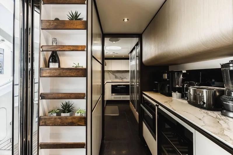 Majestic Moments Yacht Photos Pics Luxurious kitchen interior of 2019 Azimut Grande 27 METRI yacht with modern appliances.