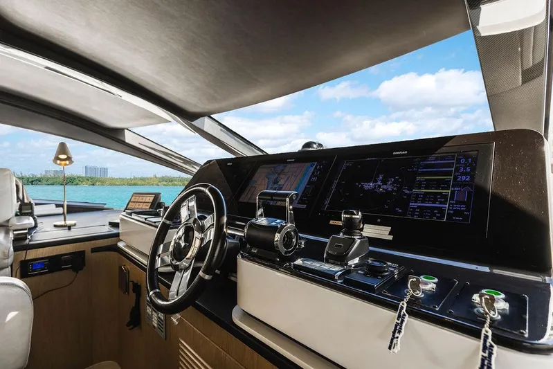 Majestic Moments Yacht Photos Pics Luxurious 2019 Azimut Grande 27 METRI yacht helm with modern navigation controls.