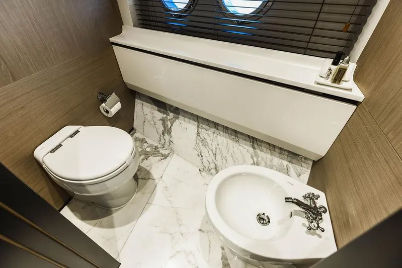 Majestic Moments Yacht Photos Pics Luxurious bathroom on 2019 Azimut Grande 27 METRI yacht with marble flooring.