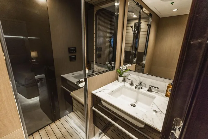 Majestic Moments Yacht Photos Pics Luxurious bathroom in 2019 Azimut Grande 27 METRI yacht with marble sink and modern fixtures.