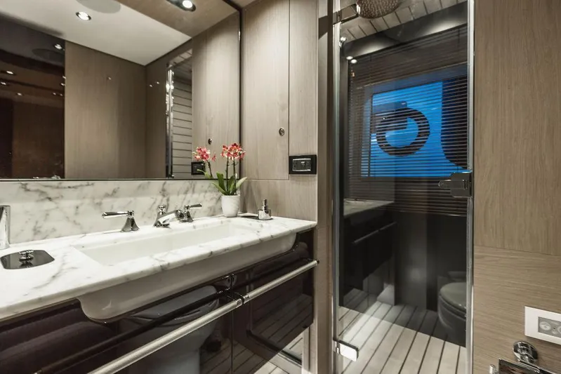 Majestic Moments Yacht Photos Pics Luxurious bathroom in 2019 Azimut Grande 27 METRI yacht with marble sink and modern fixtures.