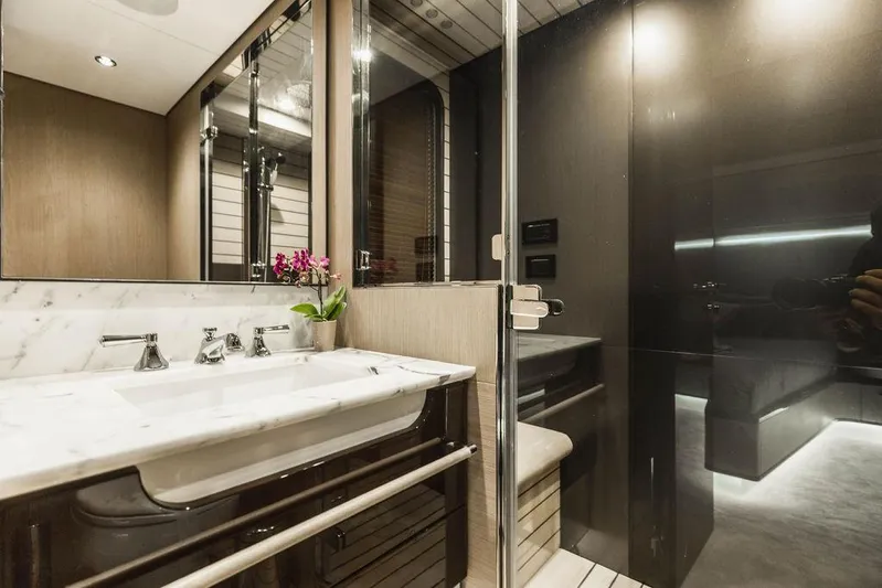 Majestic Moments Yacht Photos Pics Luxurious bathroom in 2019 Azimut Grande 27 METRI yacht with marble sink and modern fixtures.