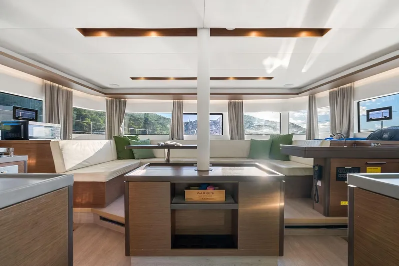 Echo Yacht Photos Pics Luxurious interior of 2023 Lagoon 50 yacht with modern furnishings and panoramic windows.