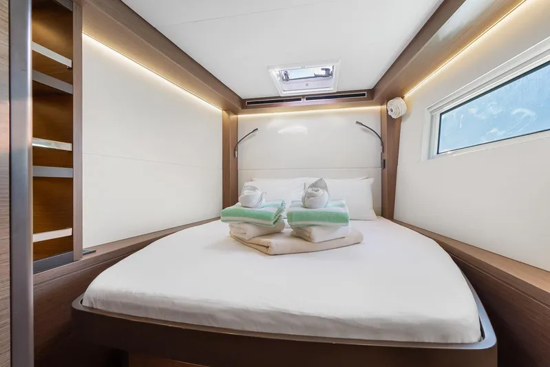Echo Yacht Photos Pics Luxurious cabin interior of 2023 Lagoon 50 yacht with neatly arranged towels.
