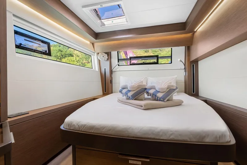 Echo Yacht Photos Pics Luxurious interior cabin of 2023 Lagoon 50 yacht with modern design and scenic windows.