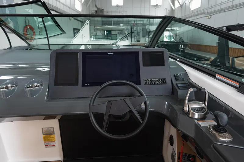  Yacht Photos Pics 2024 Aviara AV40 I/O boat dashboard with steering wheel and control panel.