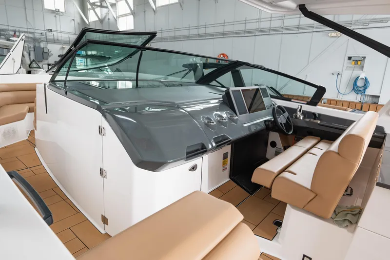  Yacht Photos Pics 2024 Aviara AV40 I/O boat interior with modern dashboard and beige seating.
